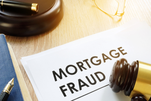 Tampa mortgage fraud lawyer represented through a gavel resting beside documents labeled Mortgage Fraud, symbolizing federal lending fraud allegations.