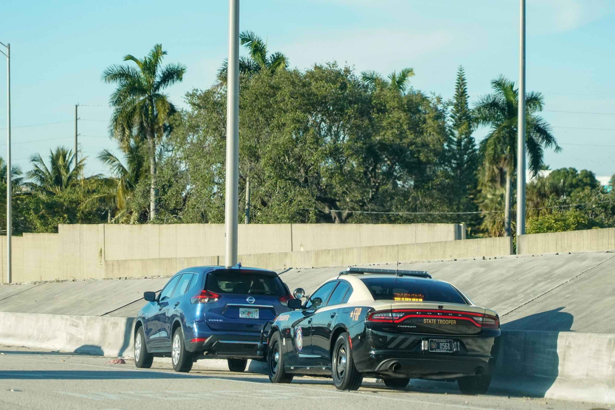 Florida Highway Patrol traffic stop on a Florida roadway, illustrating enforcement actions under the Florida Super Speeder Law for excessive speeding.